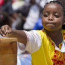 A girl makes an offering during Mass marking Missionary Childhood Day in Nairobi, Kenya, Feb. 19. Held annually by the Pontifical Missionary Childhood society, the outdoor service drew more than 30,000 children from around the Archdiocese of Nairobi. (CNS photo/Nancy Wiechec)
See KENYA-CHILDREN and KENYA-PMC