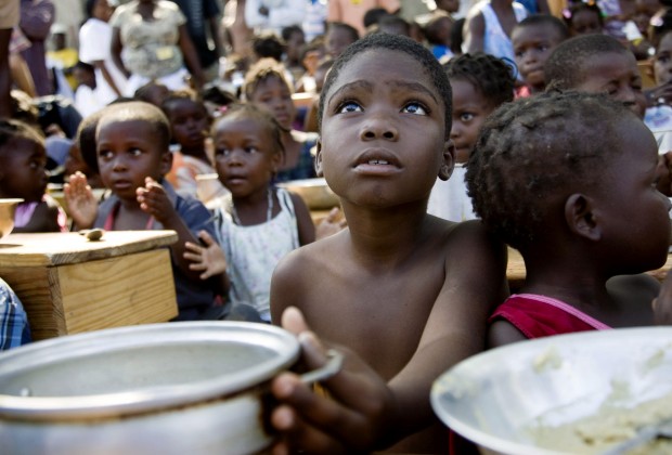 A child awaits for the distribution of meals by WFP (United Nations World Food Programme) in a make-shift camp in Jacmel January 28, 2010. An earthquake on January 12 killed some 200,000 people and devastated the impoverished country.      REUTERS/Marco Dormino/UN/MINUSTAH/Handout     (HAITI - Tags: DISASTER SOCIETY) FOR EDITORIAL USE ONLY. NOT FOR SALE FOR MARKETING OR ADVERTISING CAMPAIGNS