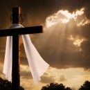 Dramatic Lighting on Christian Easter Cross As Storm Clouds Break