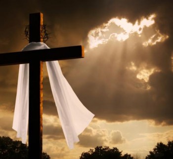 Dramatic Lighting on Christian Easter Cross As Storm Clouds Break