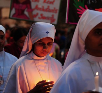 Indian Christians and social activists take part in a peace-rally and protest against the rape of a nun in Allahabad on March 16, 2015. Hundreds of priests, school girls and other protesters staged a peaceful rally March 16, 2015 in the Indian city of Kolkata to support an elderly nun who was gang-raped at her convent school. Nuns dressed in white habits joined other women of all backgrounds and ages, including girls still in their uniforms, to express their sorrow over the attack and anger over incessant levels of sexual assault in India. AFP PHOTO/ SANJAY KANOJIA        (Photo credit should read Sanjay Kanojia/AFP/Getty Images)