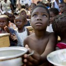 A child awaits for the distribution of meals by WFP (United Nations World Food Programme) in a make-shift camp in Jacmel January 28, 2010. An earthquake on January 12 killed some 200,000 people and devastated the impoverished country.      REUTERS/Marco Dormino/UN/MINUSTAH/Handout     (HAITI - Tags: DISASTER SOCIETY) FOR EDITORIAL USE ONLY. NOT FOR SALE FOR MARKETING OR ADVERTISING CAMPAIGNS